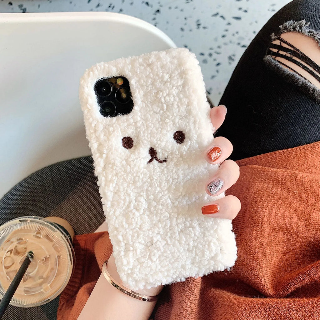 Brown plush cartoon bear face embroidered on a soft TPU iPhone case for iPhone 11.