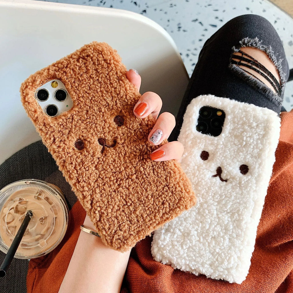 Brown plush cartoon bear face embroidered on a soft TPU iPhone case for iPhone 11.