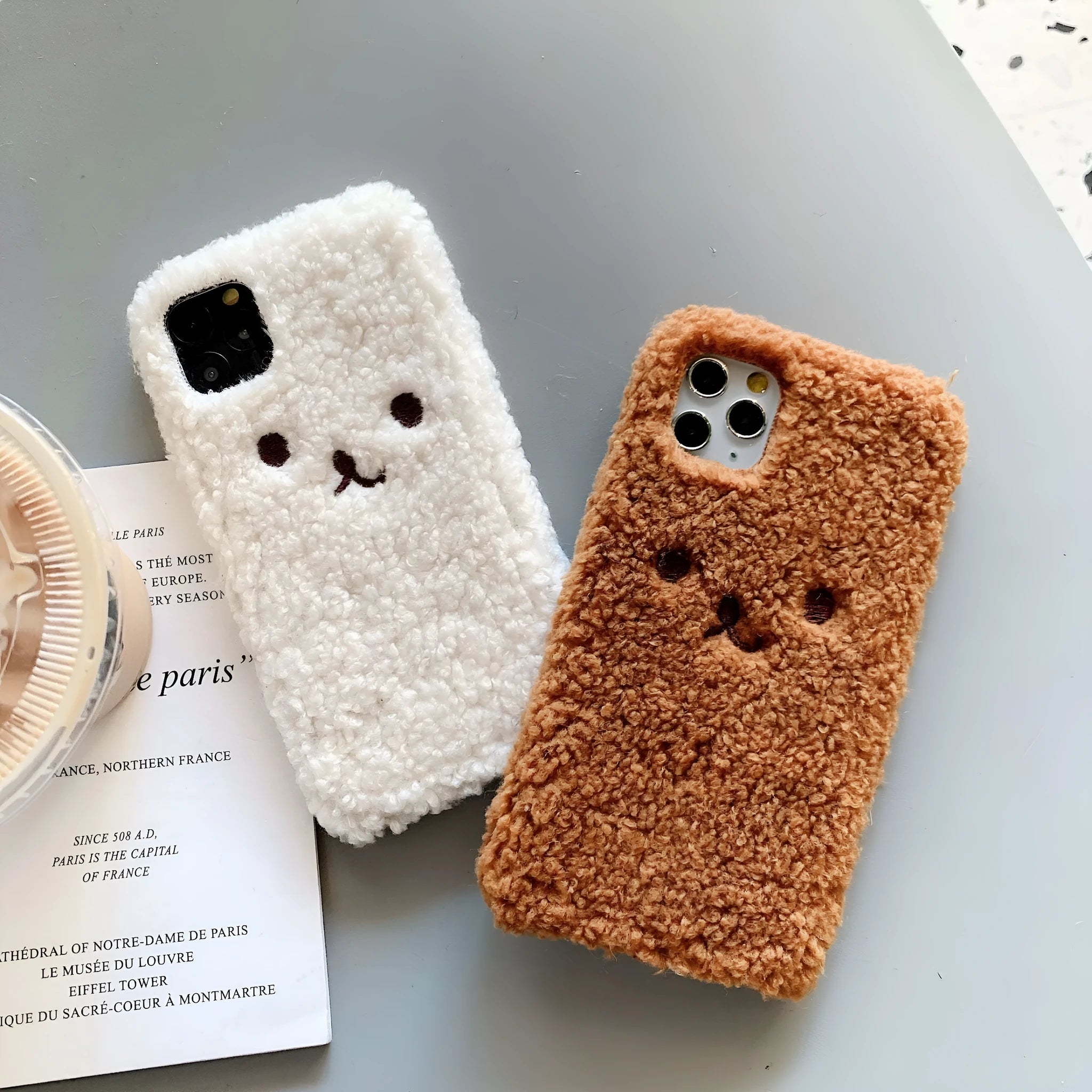 Brown plush cartoon bear face embroidered on a soft TPU iPhone case for iPhone 11.