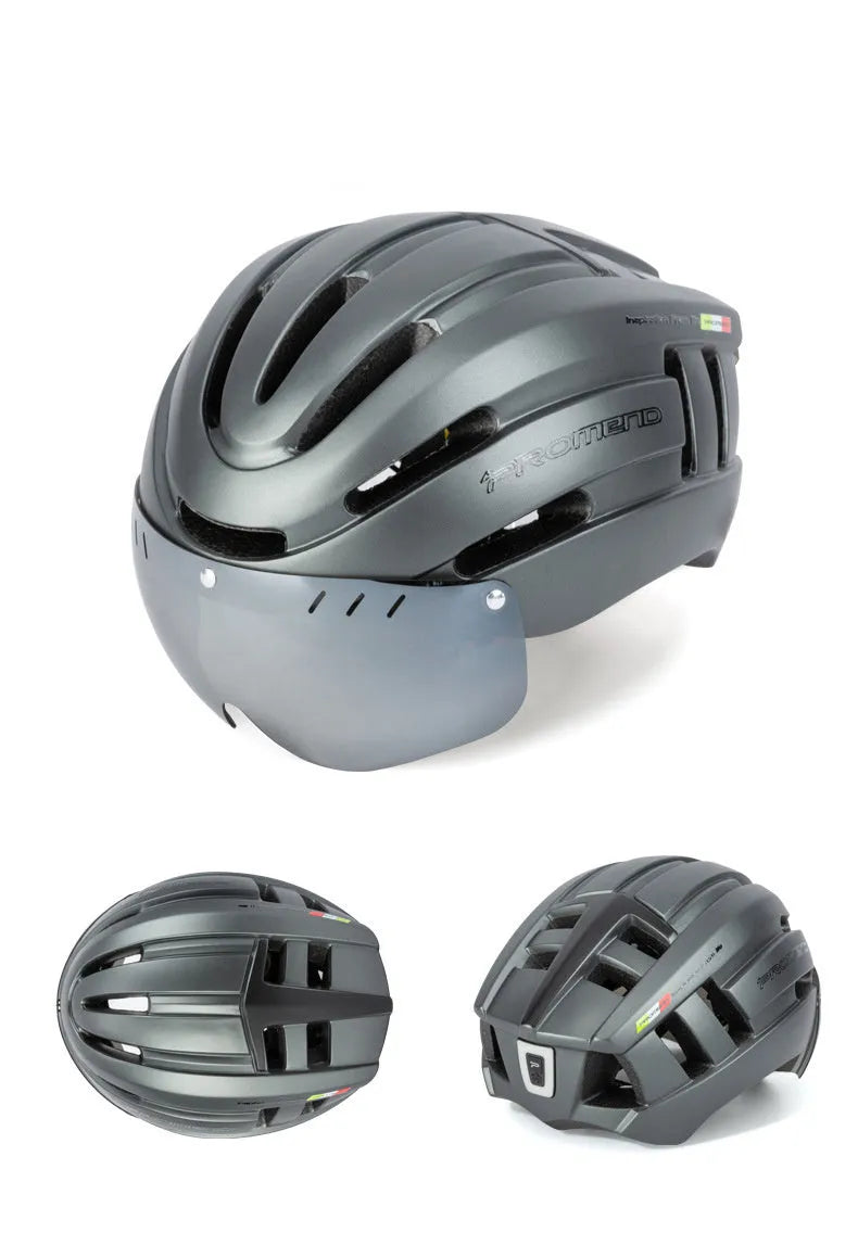Mountain bike helmet in black with orange accents, integral moulding EPS PC construction, LED taillight at rear, size L 57-62 cm