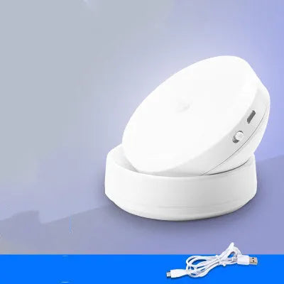 Two compact wireless motion sensor lights with induction charger.
