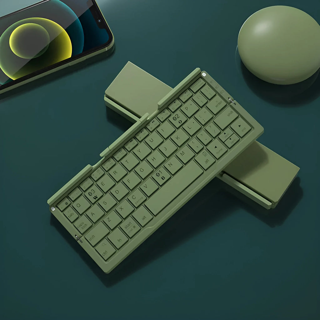 Silver and black grey foldable Bluetooth keyboard open with stand holding a mobile phone