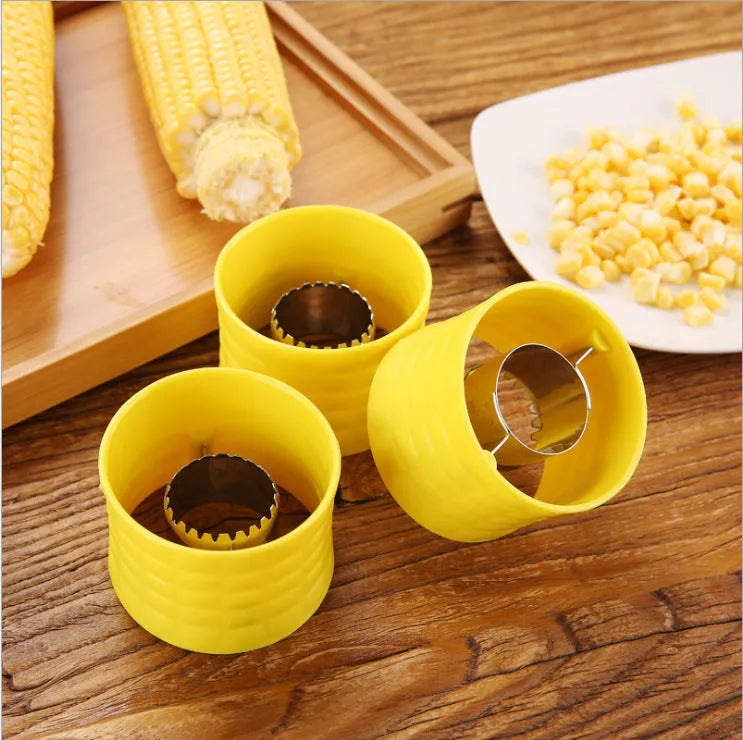 Yellow corn-shaped manual thresher with stainless steel gear for removing kernels from corn cobs