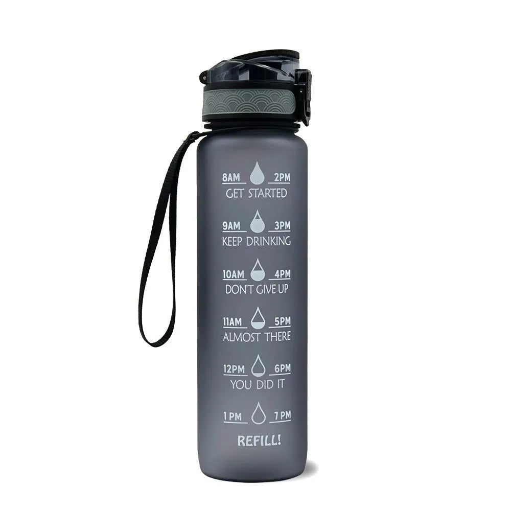 1L Tritan sports water bottle with time markers and flip-top lid in blue-red gradient colour