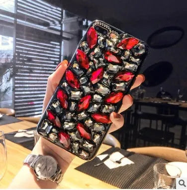 Clear TPU iPhone case with rhinestone decoration on the back, showing Black and Green colour options.