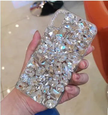 Clear TPU iPhone case with rhinestone decoration on the back, showing Black and Green colour options.