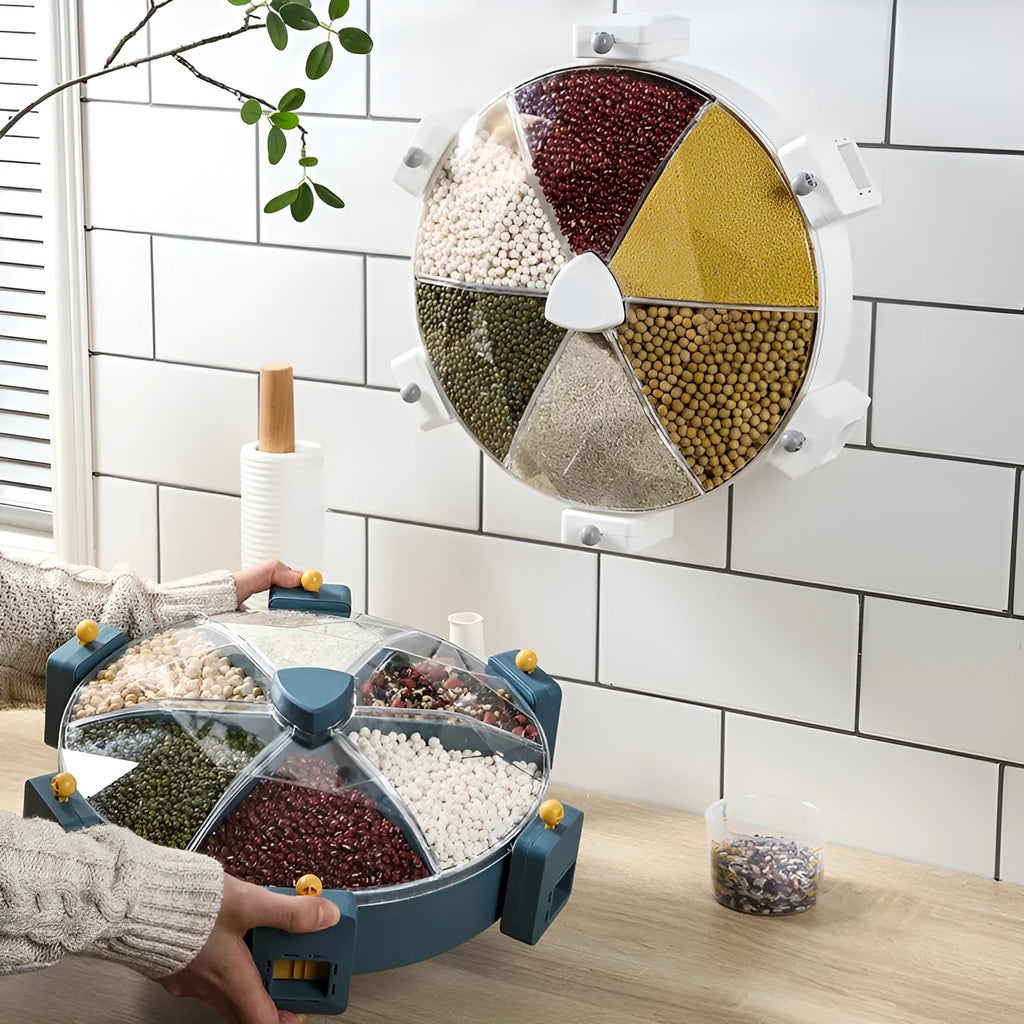 Wall-mounted rotating grain dispenser with six compartments, blue-yellow colour, showing 360° rotation feature