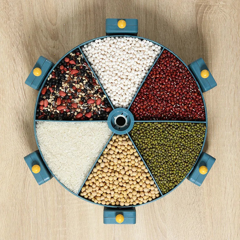 Wall-mounted rotating grain dispenser with six compartments, blue-yellow colour, showing 360° rotation feature