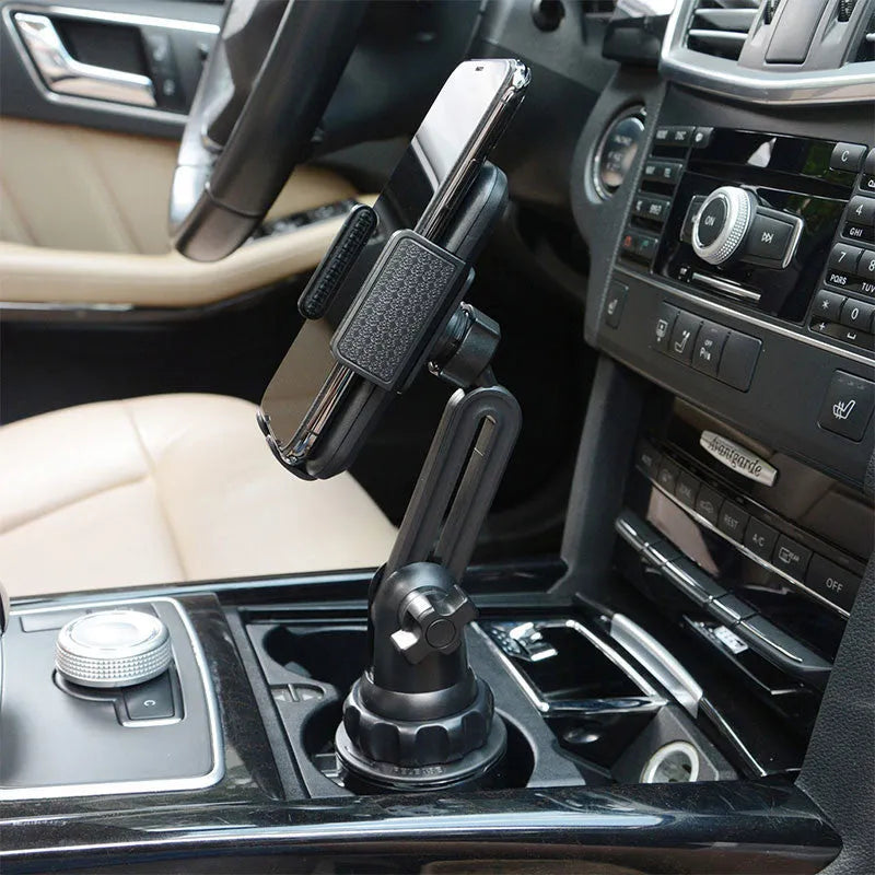 Black ABS plastic car phone holder with adjustable 360-degree rotating bracket and soft foam contact pads.