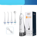 White portable oral irrigator with large 330ml water tank and multiple nozzles on a bathroom counter