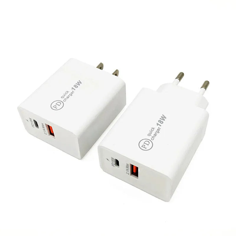 White 18W USB-C PD fast charger wall adapter with US plug on a table.