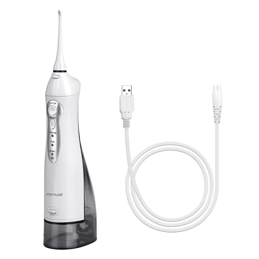 White portable oral irrigator with large 330ml water tank and multiple nozzles on a bathroom counter