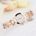 Alloy quartz watch with 2.4cm gold-tone dial and 19.5cm strap in rose gold black colour.