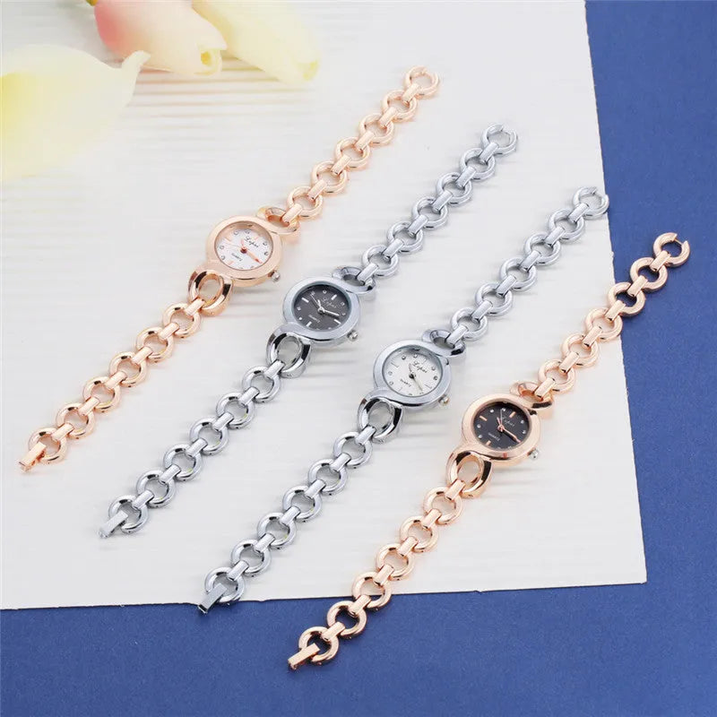 Alloy quartz watch with 2.4cm gold-tone dial and 19.5cm strap in rose gold black colour.