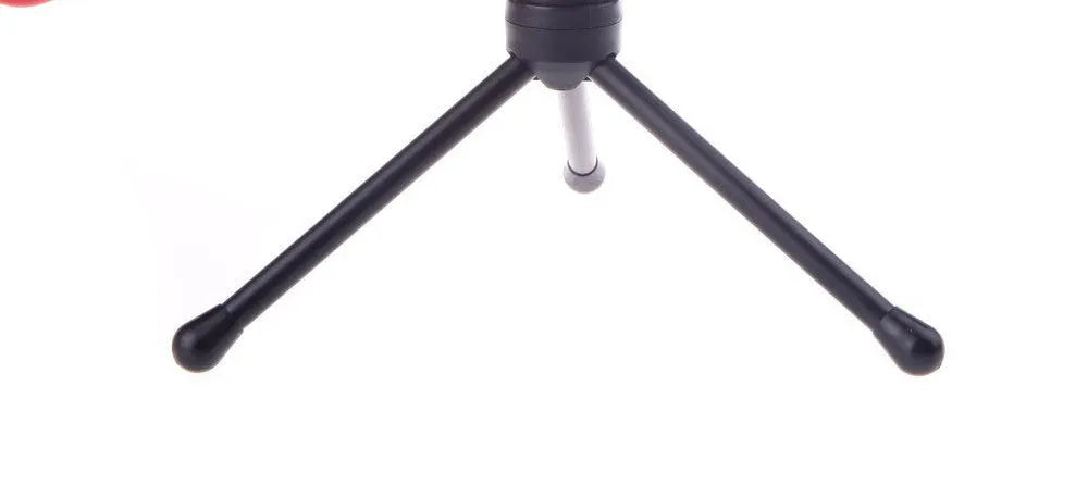 Black wired computer microphone with clothing clip and desk mounting bracket on a white background.
