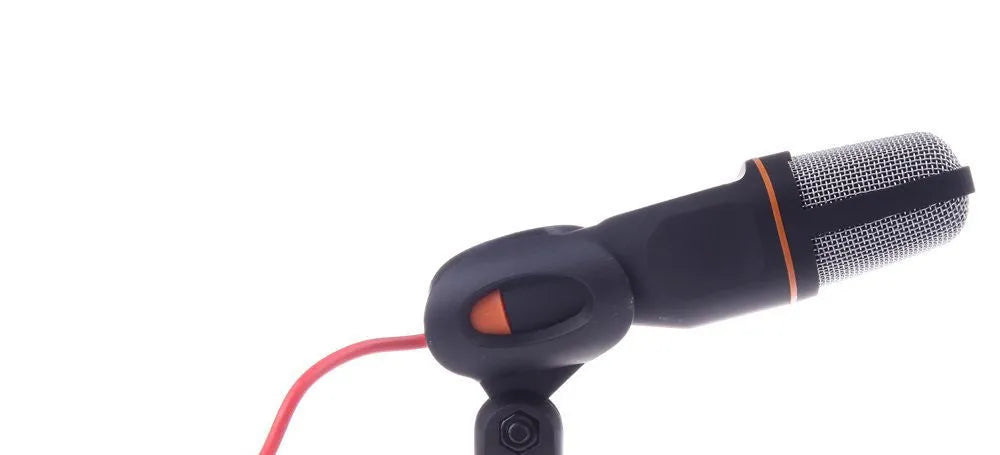 Black wired computer microphone with clothing clip and desk mounting bracket on a white background.