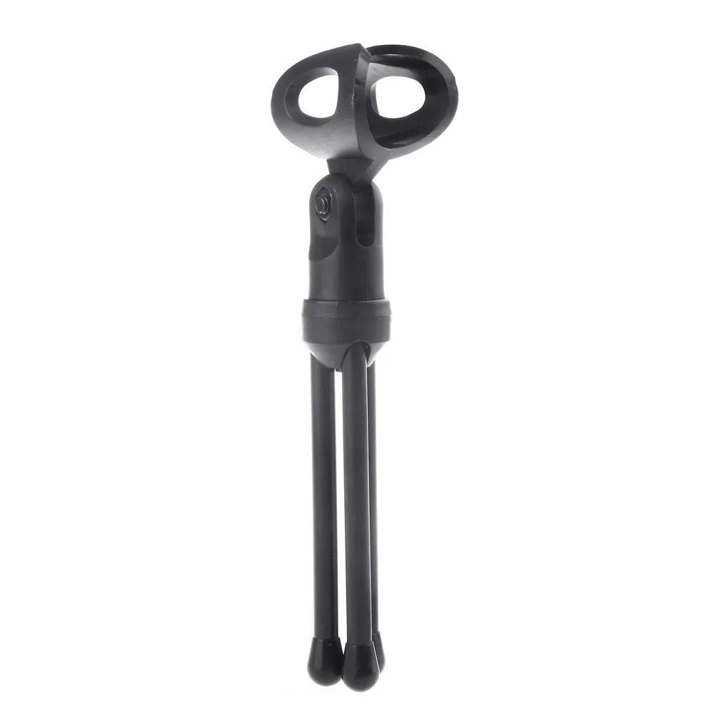 Black wired computer microphone with clothing clip and desk mounting bracket on a white background.