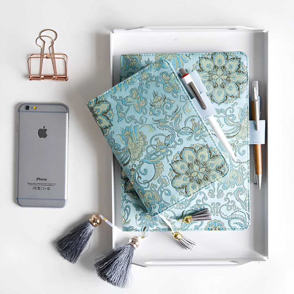 Fabric-covered Flying Blue Flower notebook in A5 and A6 sizes with 100g paper.