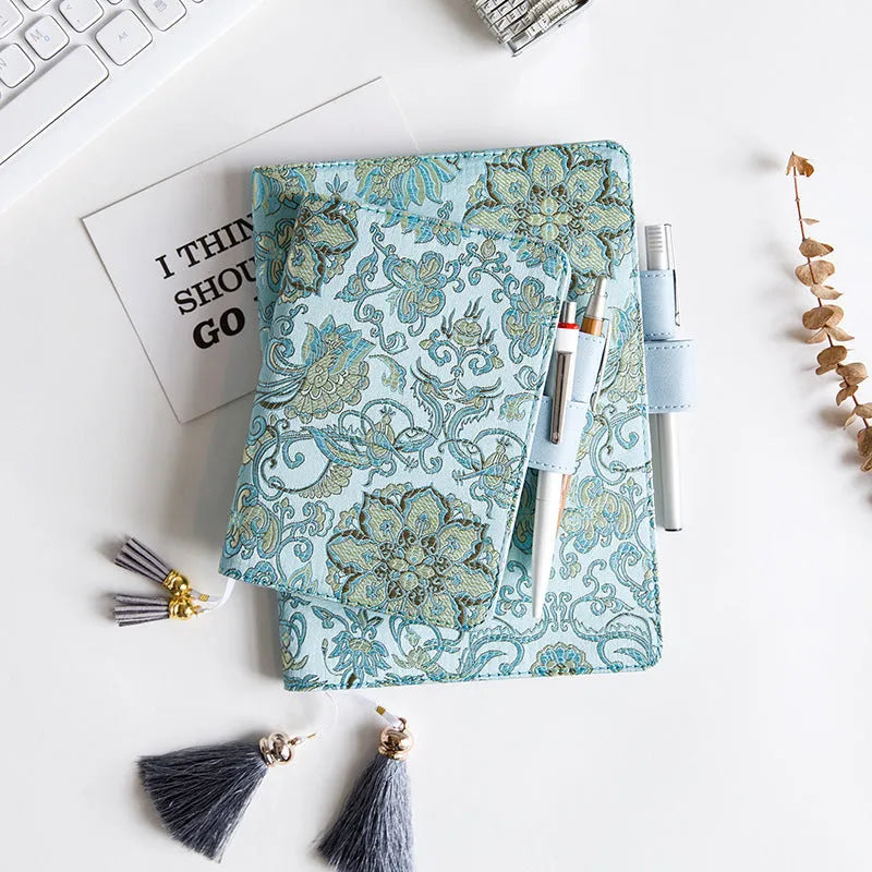 Fabric-covered Flying Blue Flower notebook in A5 and A6 sizes with 100g paper.