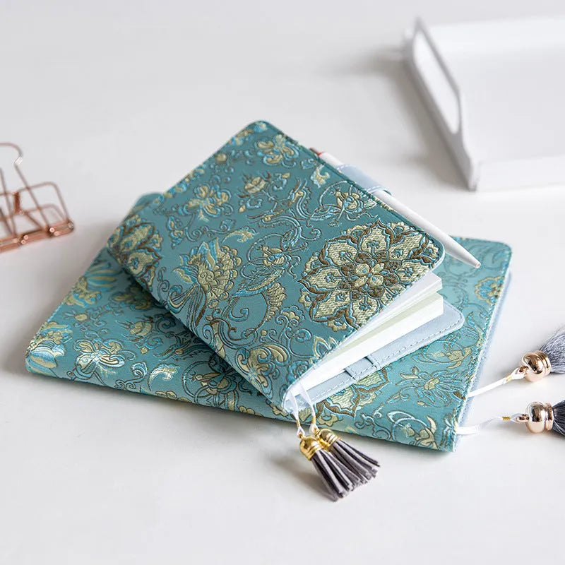 Fabric-covered Flying Blue Flower notebook in A5 and A6 sizes with 100g paper.