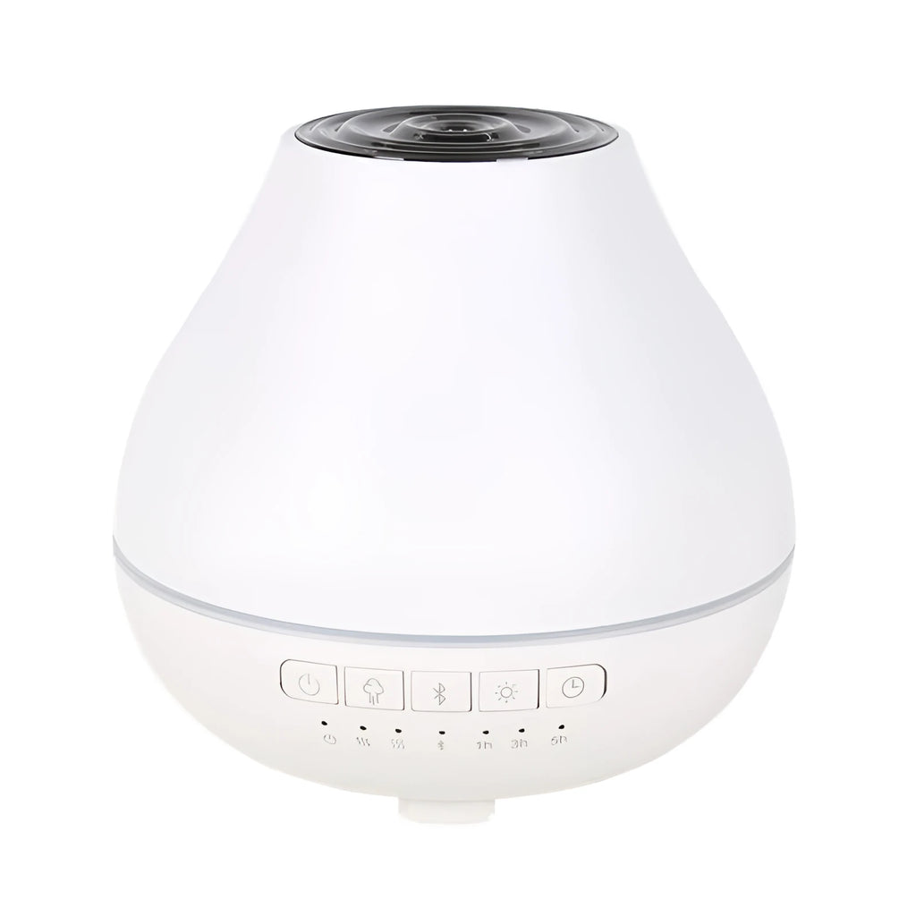 White round Bluetooth humidifier and aroma diffuser with night light on a table.