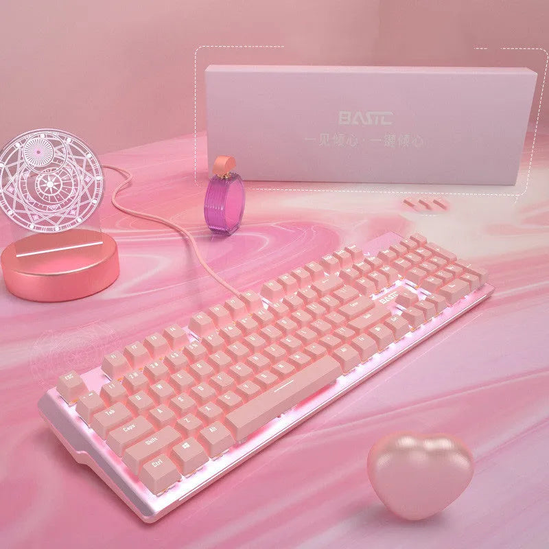 Pink wired mechanical keyboard and gaming mouse set on a desk.