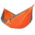 Nylon rope hammock in blue with anti-rollover design and mosquito net for outdoor camping use