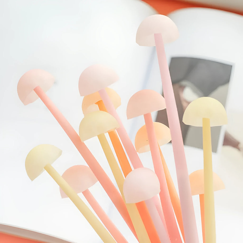 Luminous mushroom silicone gel pen with black core and cap on a white background