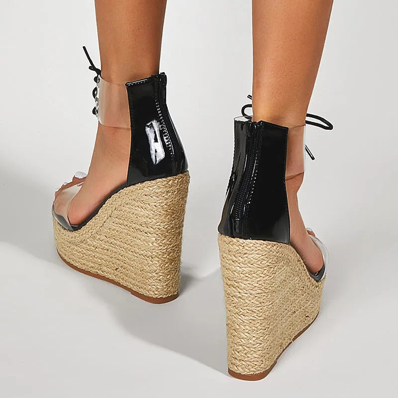 Black women's wedge sandals with hemp rope detail and high 8cm heel on a light background.