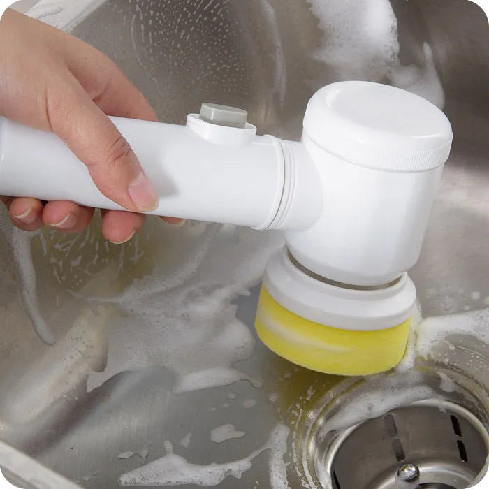 White cordless electric cleaning brush with three interchangeable nylon brush heads for household surfaces