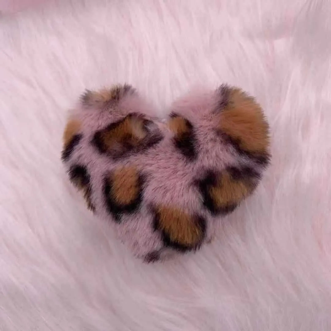 Leopard print plush heart keychain with imitation rex rabbit fur ball on a white background