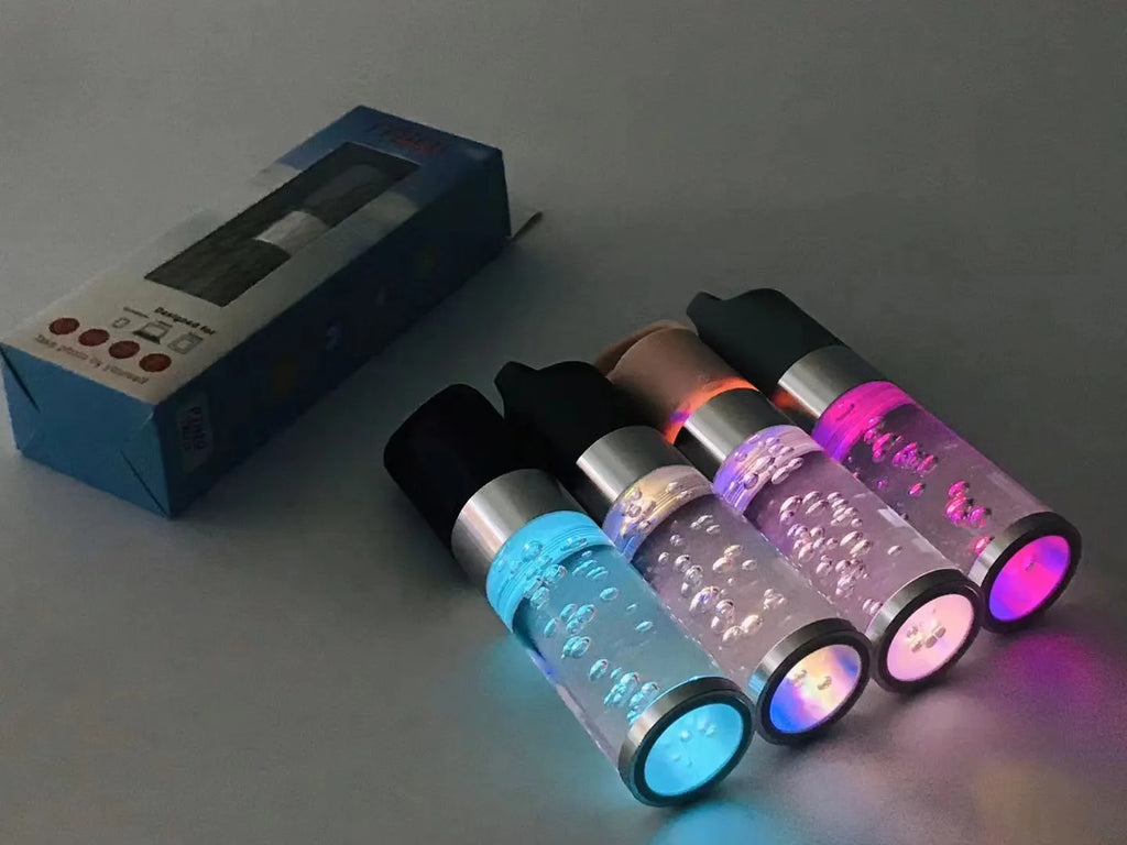Compact pink Bluetooth speaker with colourful crystal LED lights, showing front and side.