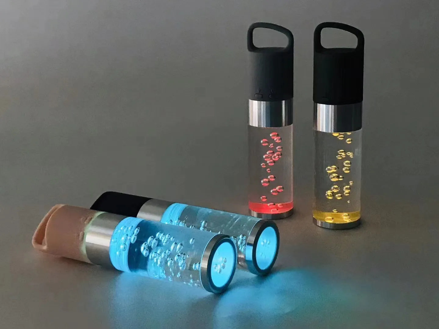 Compact pink Bluetooth speaker with colourful crystal LED lights, showing front and side.