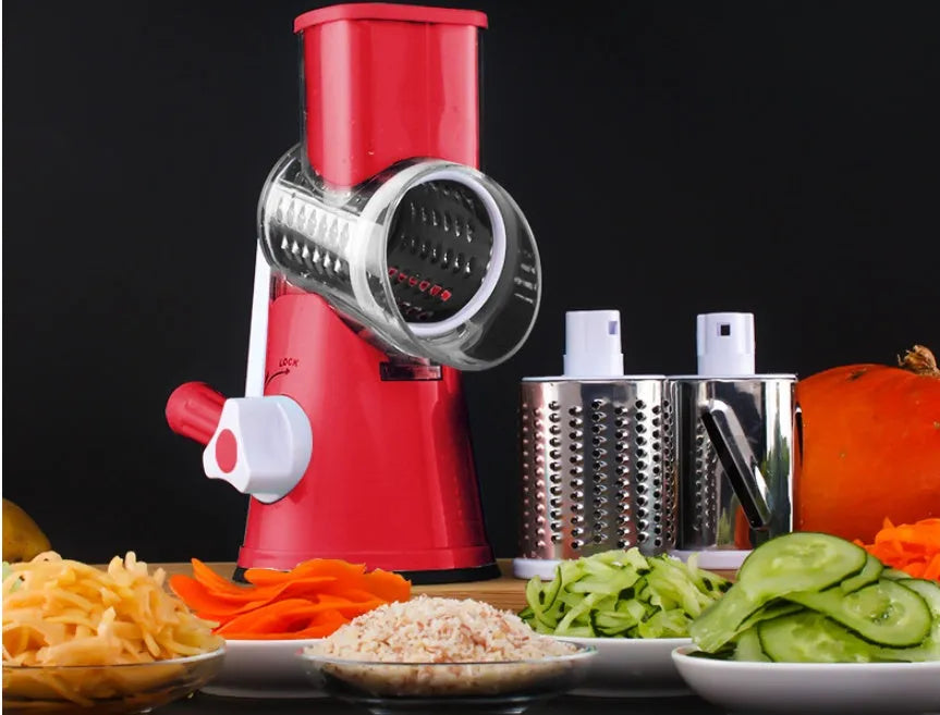 Round vegetable mandoline slicer with stainless steel blades and suction base in green colour