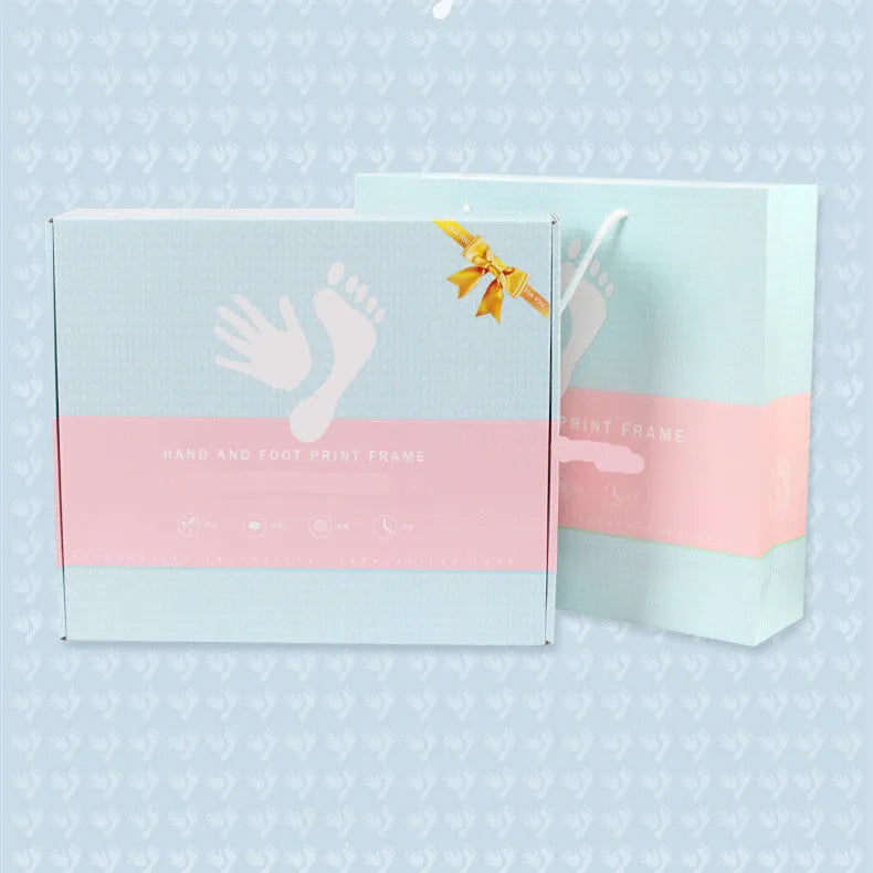 A modern DIY frame for displaying a baby's hand and foot prints, shown in a choice of colours.