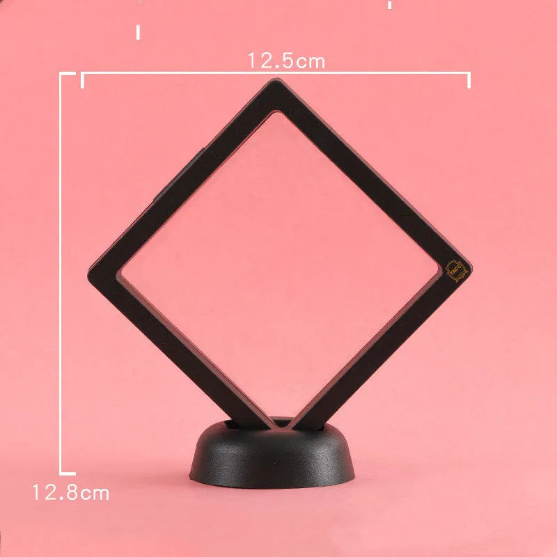 3D floating display case holding coins and jewellery between transparent membrane sheets
