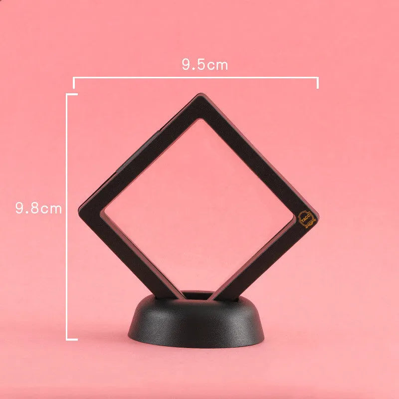 3D floating display case holding coins and jewellery between transparent membrane sheets