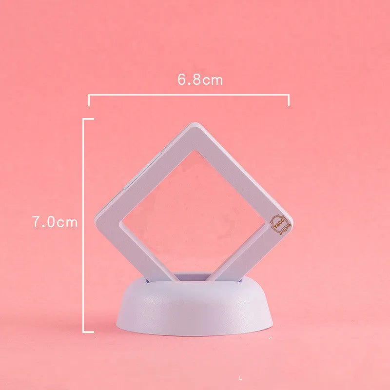 3D floating display case holding coins and jewellery between transparent membrane sheets