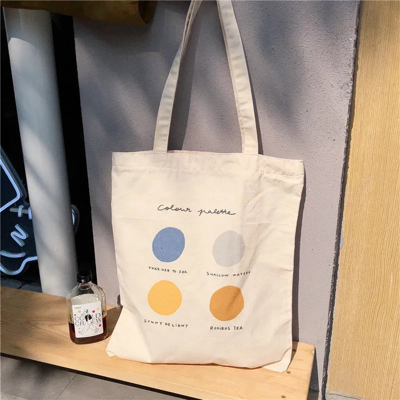 Women's canvas tote shopper bag with geometric pattern in light pink colour showing zipper opening and soft handles