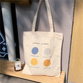 Women's canvas tote shopper bag with geometric pattern in light pink colour showing zipper opening and soft handles