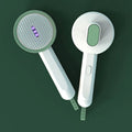 Hoopet 2-in-1 pet grooming comb with UVC light, rounded teeth, and travel size, shown in ivory white colour