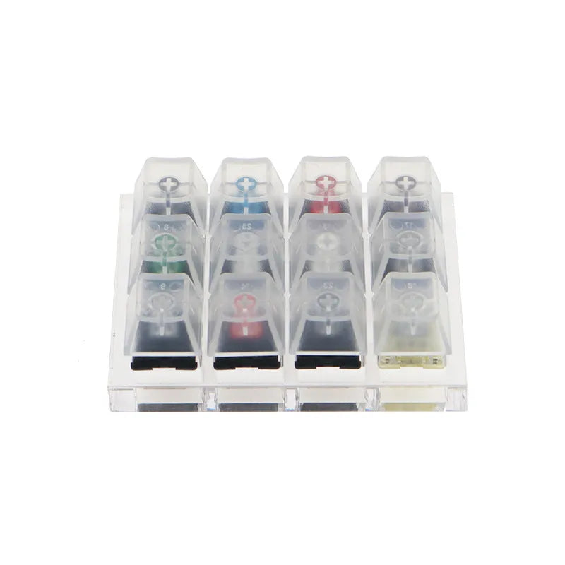 White Cherry mechanical keyboard switch tester showing twelve different MX switches.