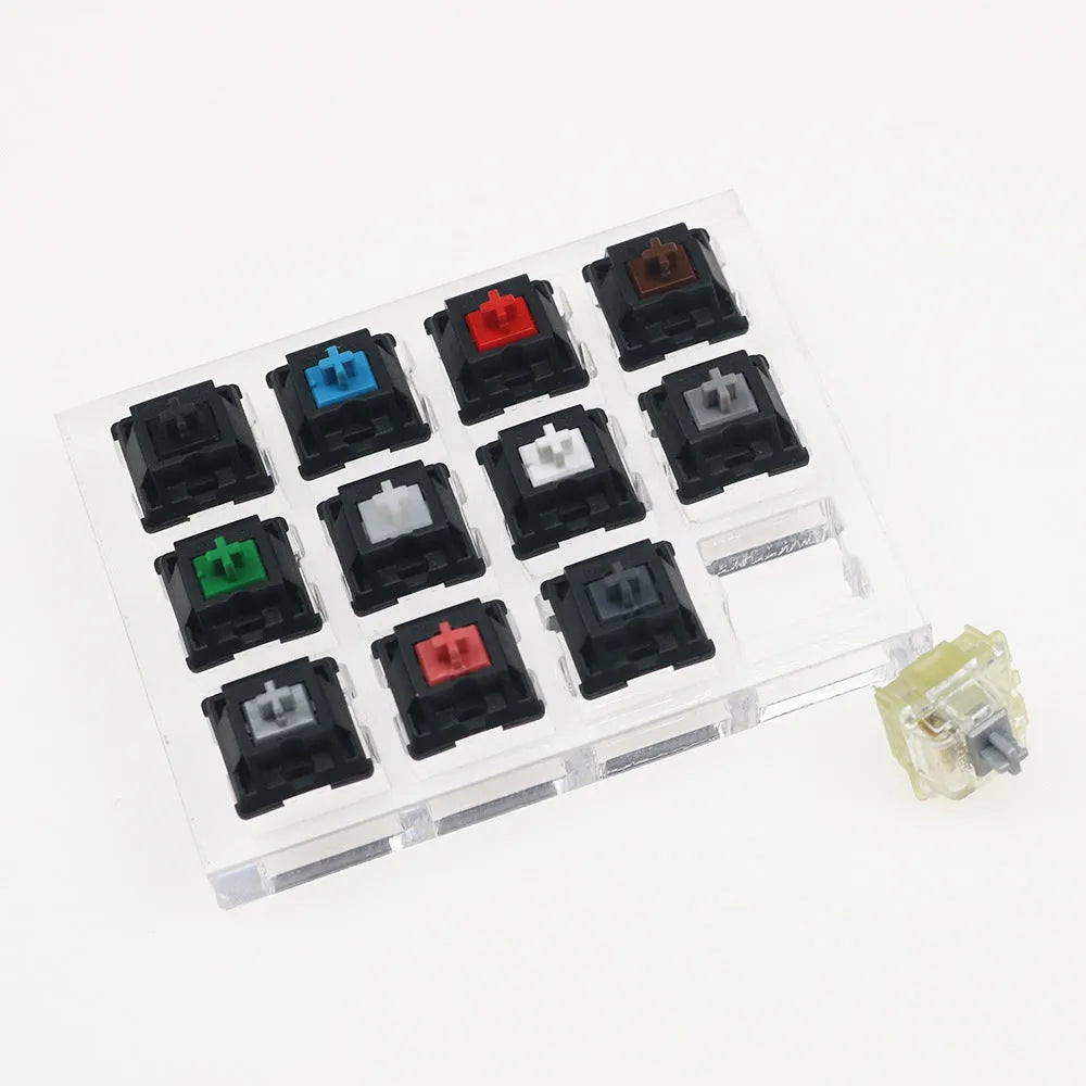 White Cherry mechanical keyboard switch tester showing twelve different MX switches.