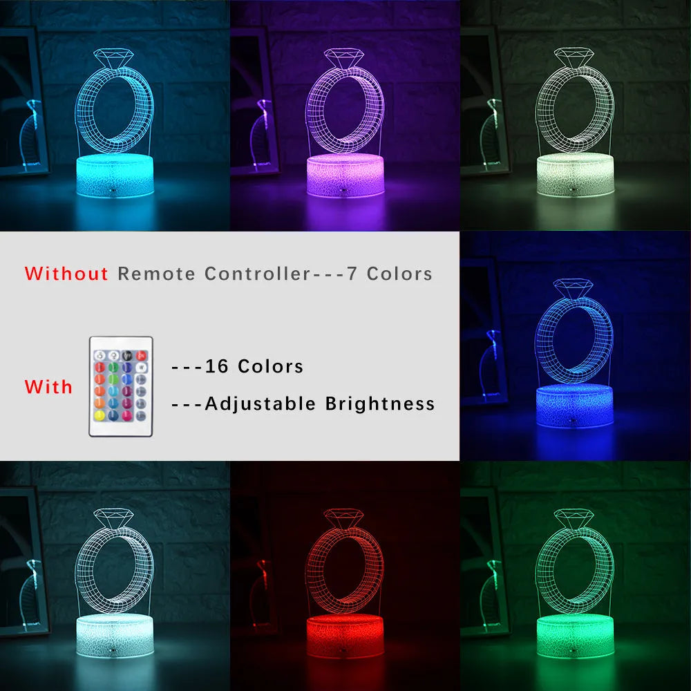 3D holographic diamond ring LED night light with colour changing modes on a bedside table.