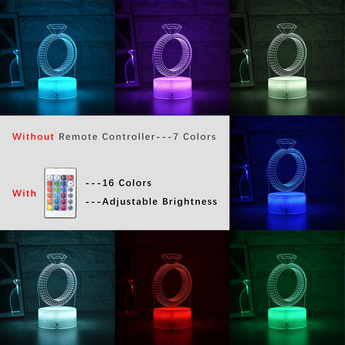 3D holographic diamond ring LED night light with colour changing modes on a bedside table.