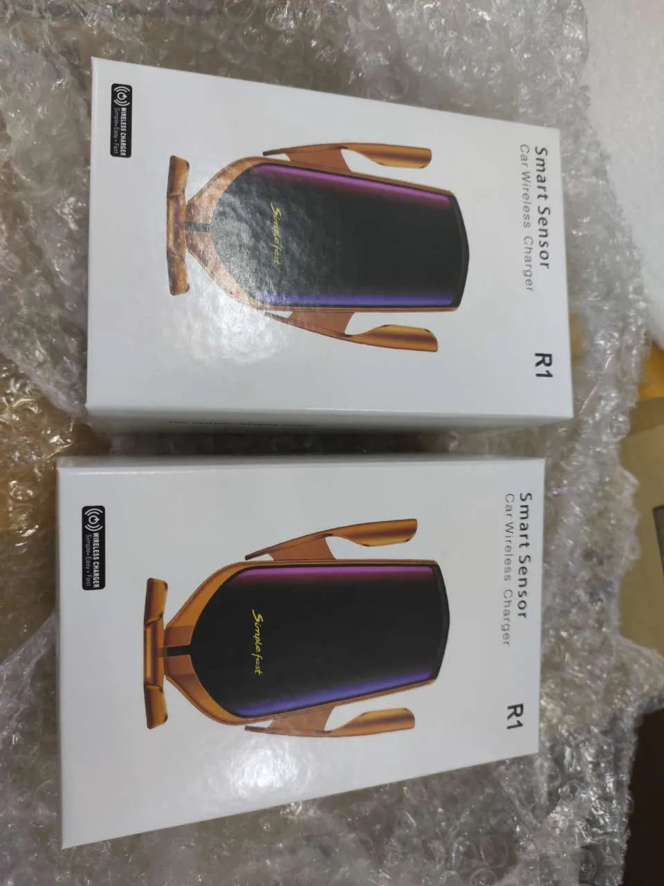 R1 Magic Clip automatic car phone holder with wireless charging in gold finish mounted on dashboard
