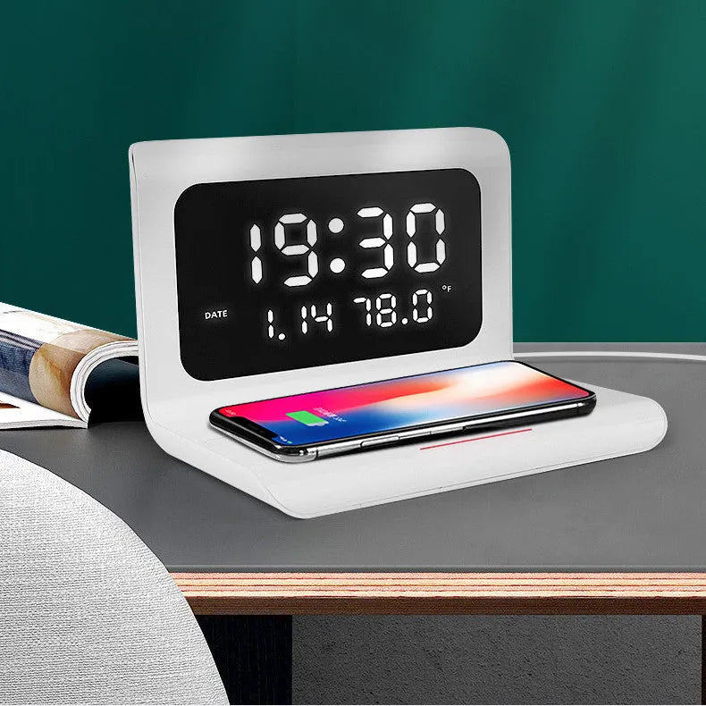 Wireless charger alarm clock showing calendar display with temperature and humidity readings