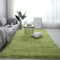 Nordic style rectangular plush carpet in a light colour on a wooden floor, showing fluffy texture.