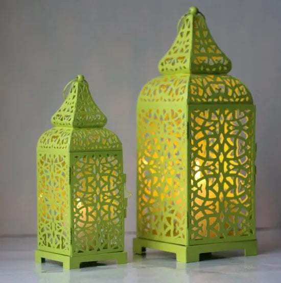 Blue iron Moroccan candelabrum with hollow geometric design, 38 cm tall, holding a tea light.