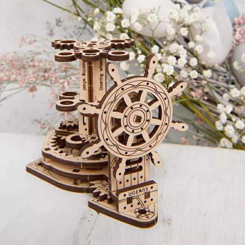 Ukrainian wooden rotating machinery model pen holder on a desk.